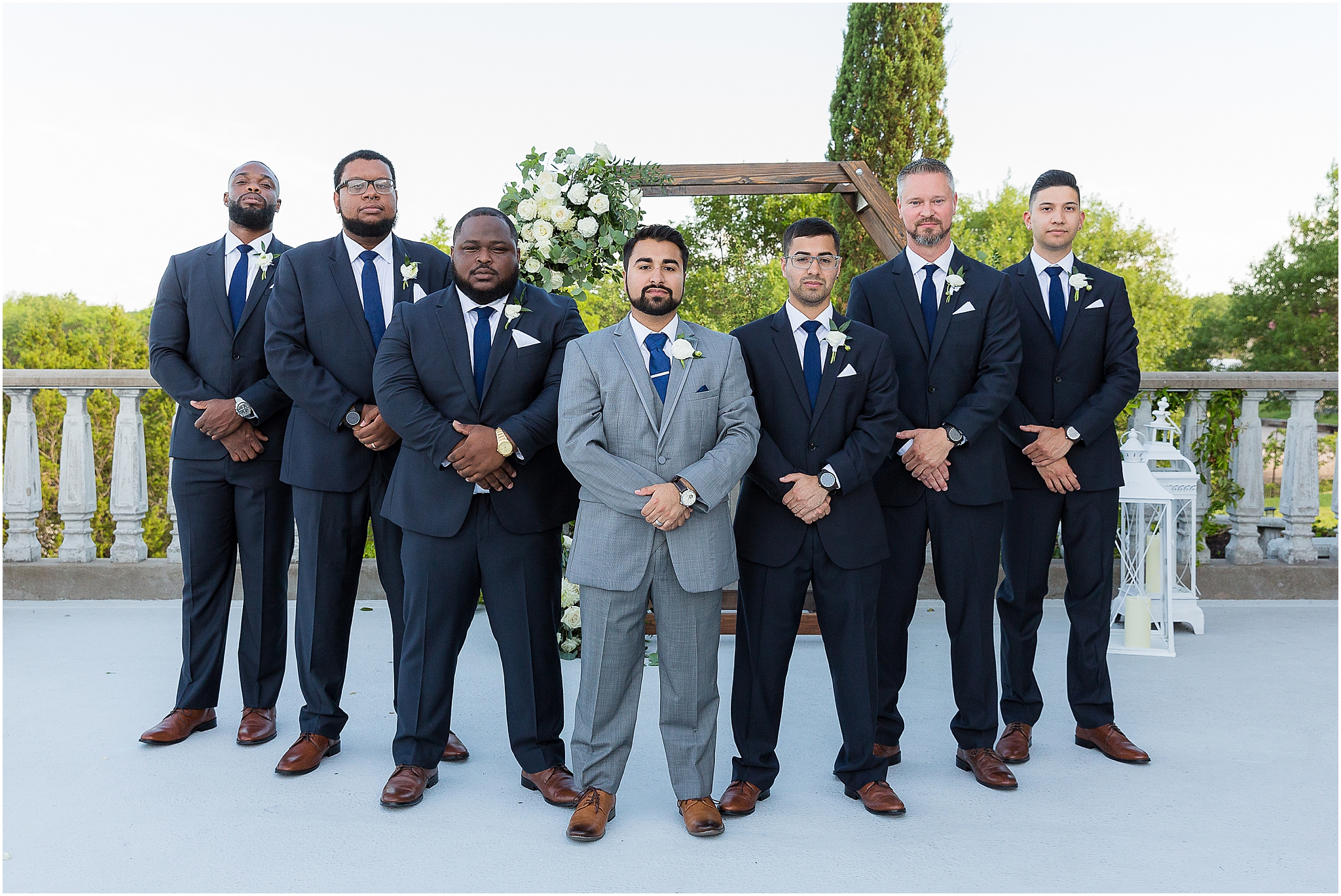 groom and groomsmen in grey and black suits
