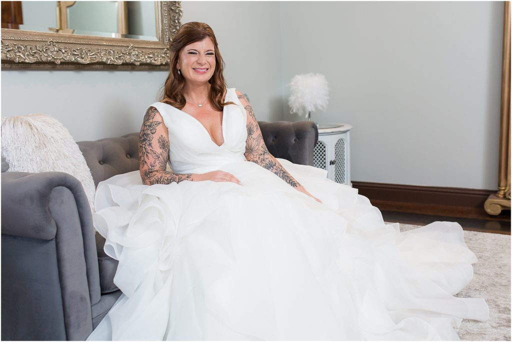 bride sitting in wedding dress in bridal suite at stoney ridge villa azle tx