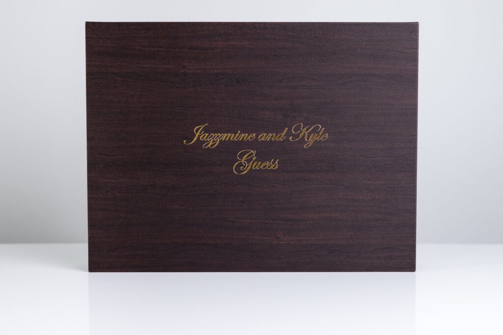 dark wood heirloom box for wedding album safekeeping with bride and groom's name foiled on it