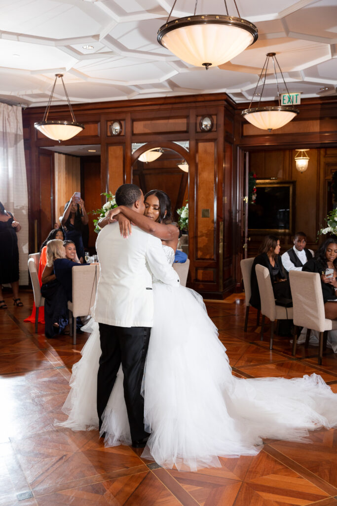 bride and groom slow dancing at their wedding reception