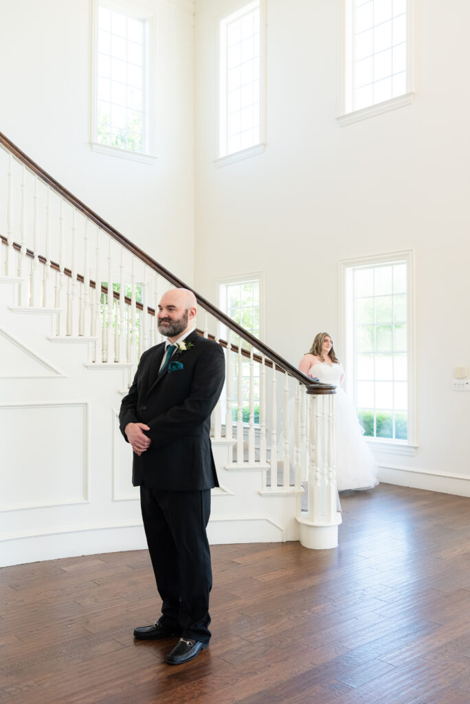 Bride walking down stairs for first look