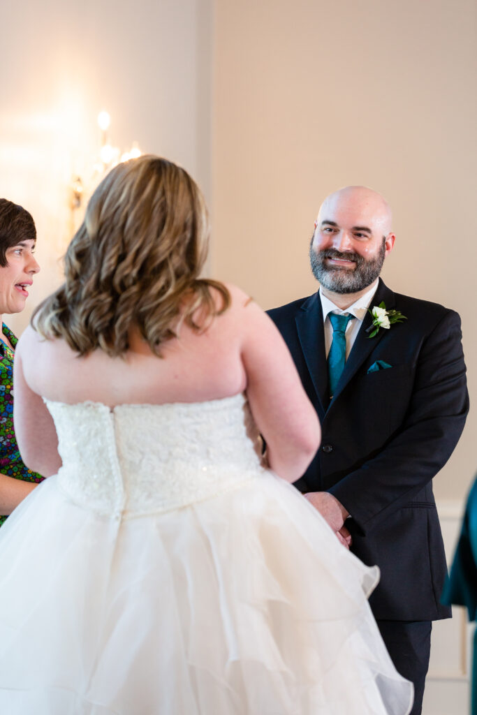Dallas wedding photographers capture groom during wedding ceremony