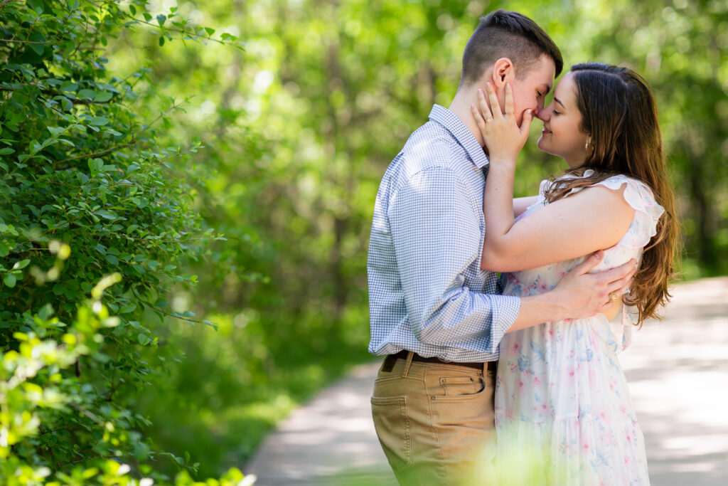Dallas wedding photographers capture newly engaged couple kissing at Arbor Hill Nature Preserve
