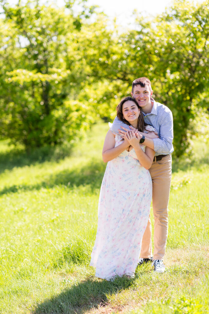 Dallas wedding photographers capture couple hugging after recent engagement