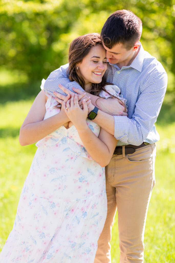 Dallas wedding photographers capture man hugging woman after proposal