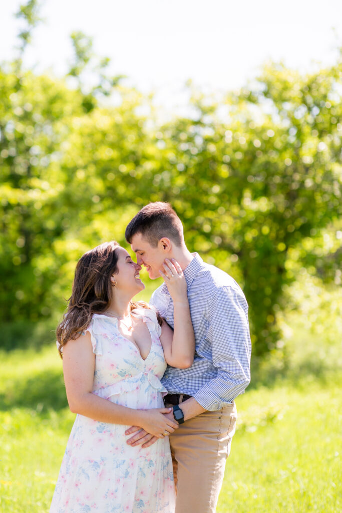 Dallas wedding photographers capture couple embracing during engagement photos at arbor hills nature preserve