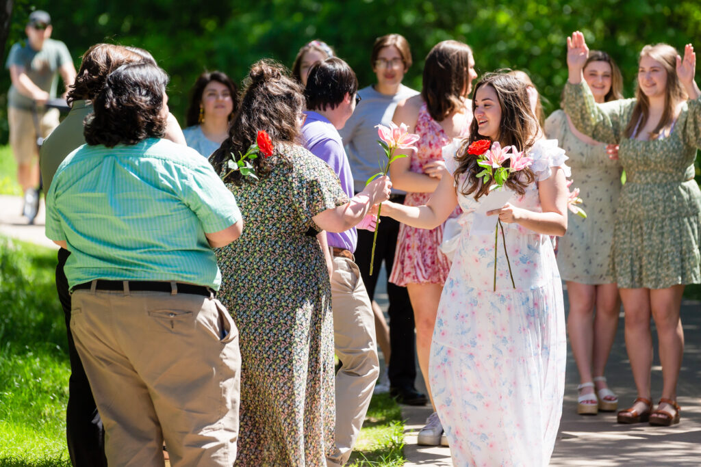 Dallas wedding photographers capture woman holding flowers at Arbor Hills Nature Preserve