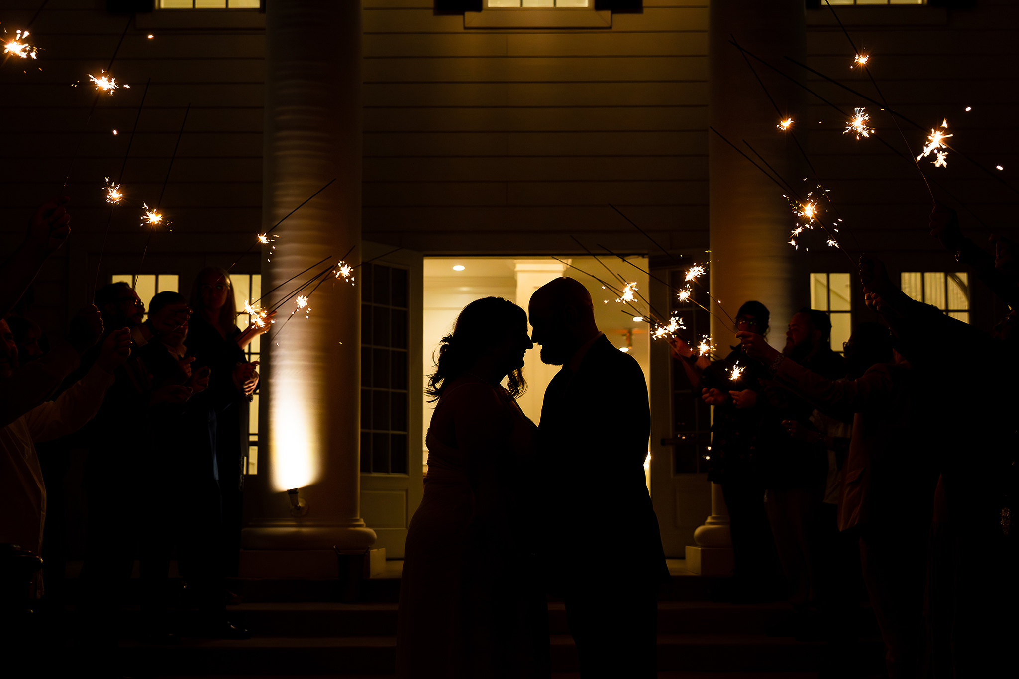 Silhouette photo of bride and groom surrounded by sparklers against milestone denton wedding venue by Stefani Ciotti Photography a dallas wedding photographer