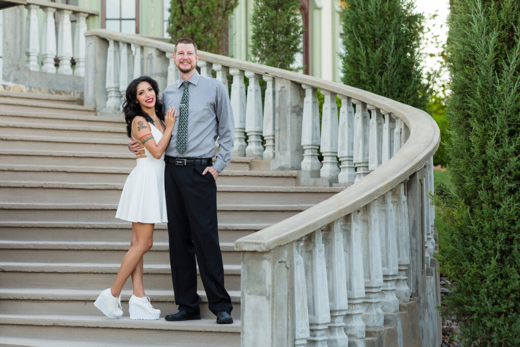 Dallas wedding photographers capture woman and man embracing on staircase