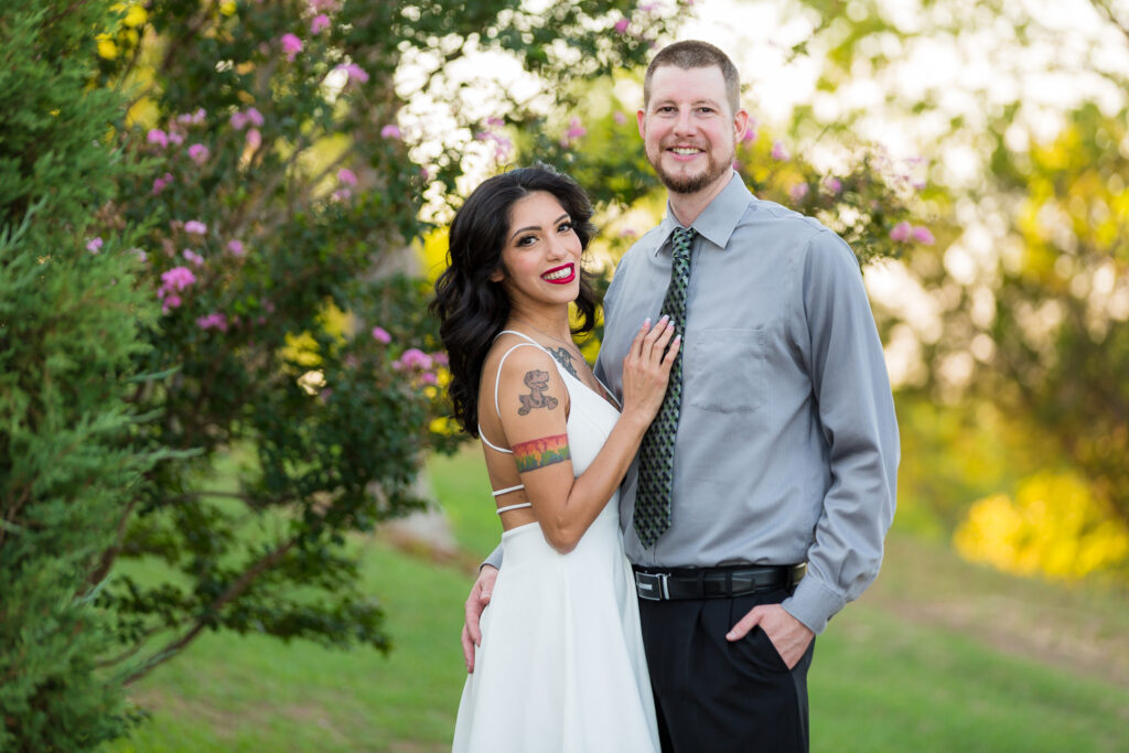 Dallas wedding photographers captures woman wearing white dress while man wears gray dress