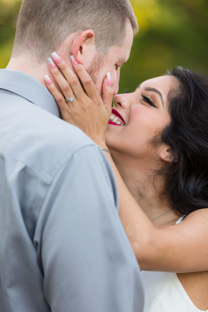Dallas wedding photographers captures woman holding man's face