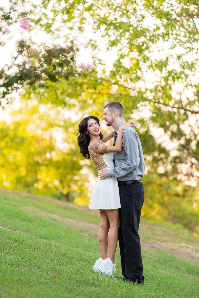 Dallas wedding photographers capture couple together in grassy area