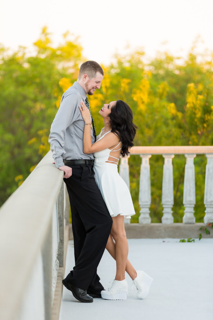 Dallas wedding photographers capture woman looking up at man during engagement session