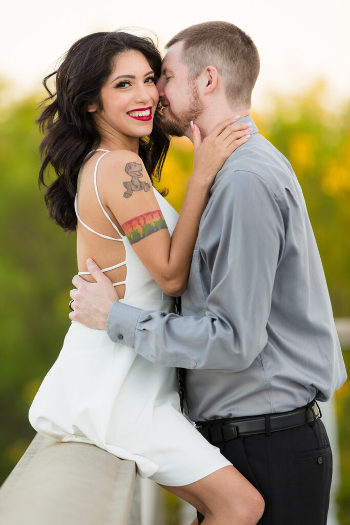 Dallas wedding photographers captures woman sitting on ledge 