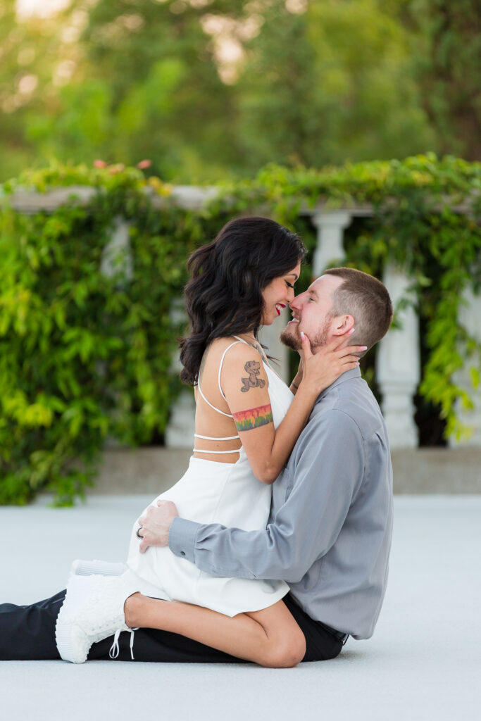 Dallas wedding photographers capture woman sitting on man's lap 