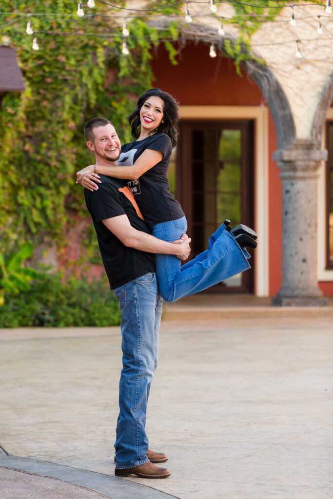 Dallas wedding photographers capture couple celebrating during outdoor engagement session