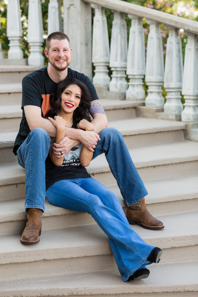 Dallas wedding photographers capture couple sitting on stairs together