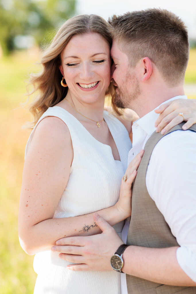 Dallas wedding photographers capture close up of couple hugging during engagements