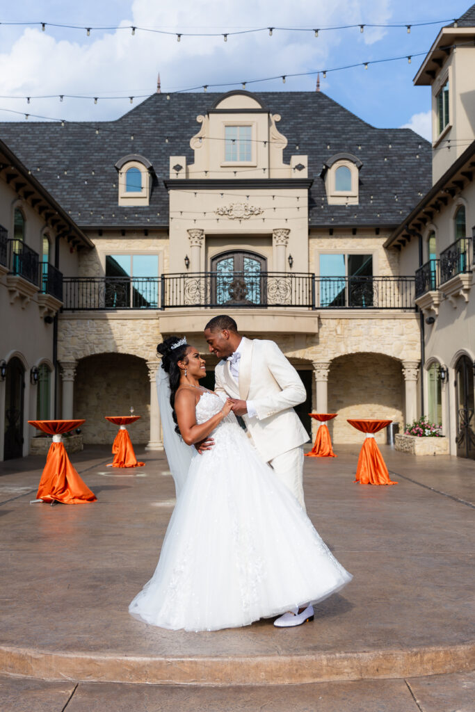 Dallas wedding photographers capture bride and groom holding hands at Knotting Hill Place