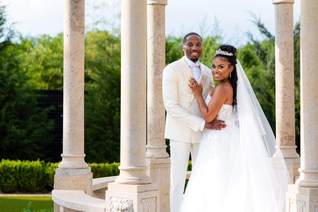 Bride and groom smiling in gazebo with Stefani Ciotti Photography in Dallas texas