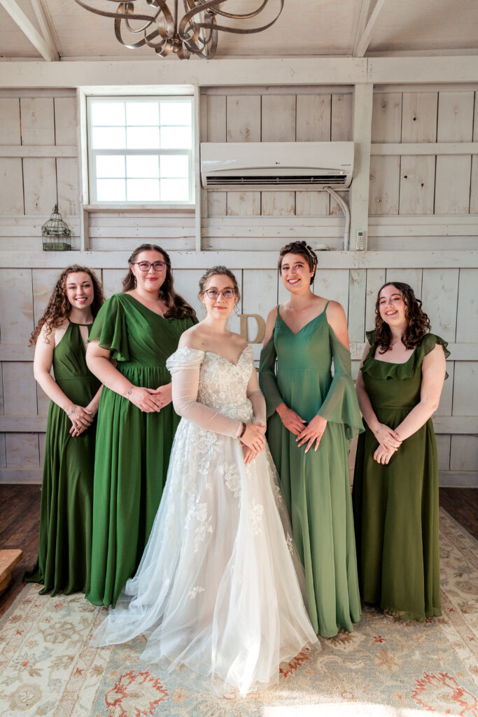 Dallas wedding photographers capture bride standing with bridesmaids