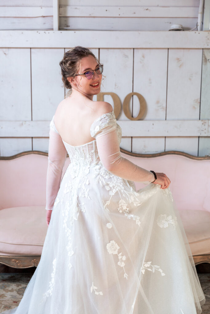 Dallas wedding photographers capture bride looking over shoulder during bridal portraits