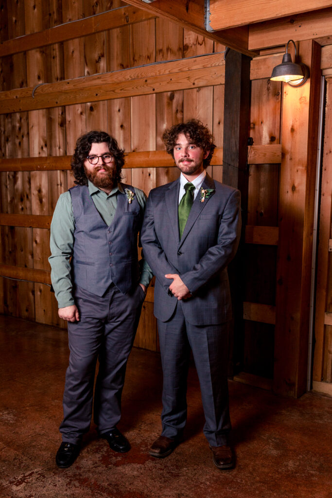 Dallas wedding photographers capture groom standing with best man before wedding