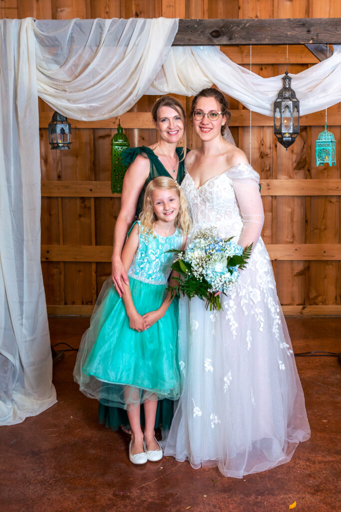Dallas wedding photographers capture bride standing with family