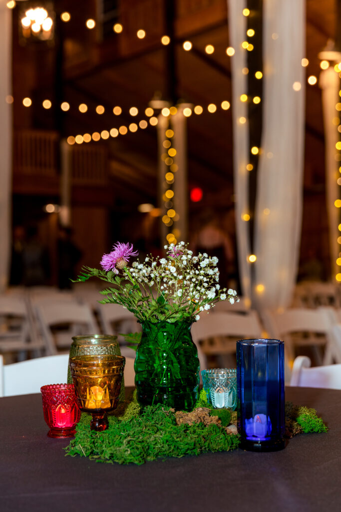 Dallas wedding photographers capture table decor at evening reception at the Big White Barn