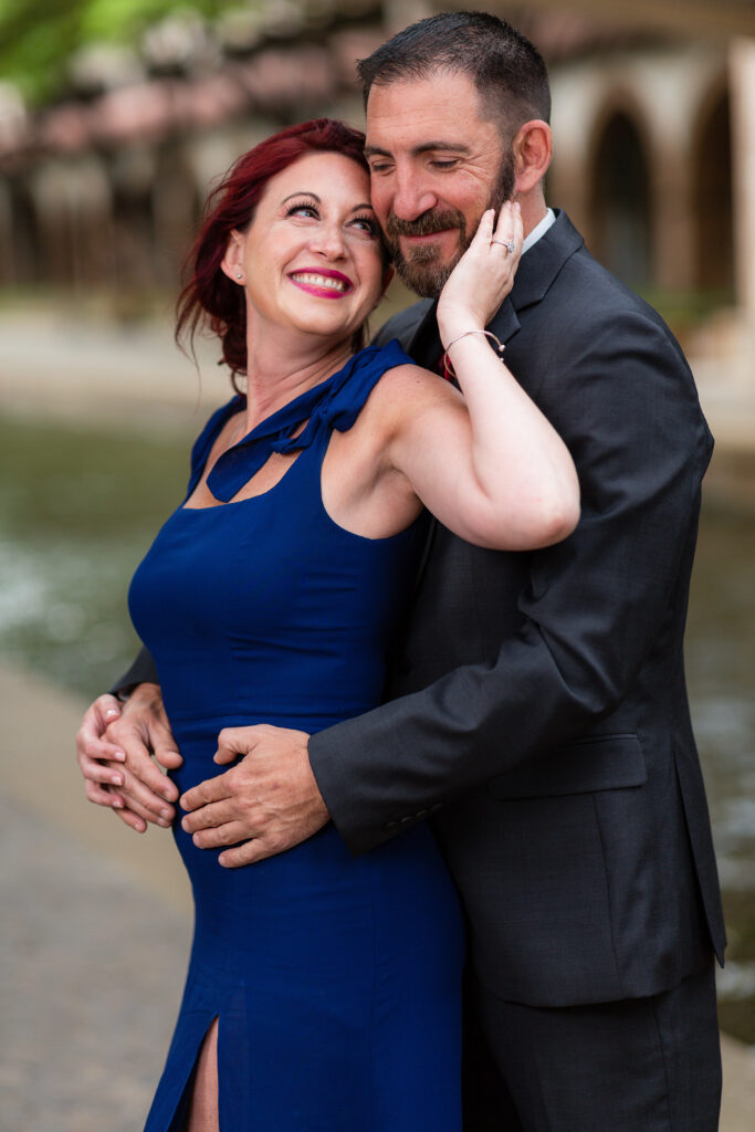 Engagement Photographer Dallas captures woman holding man's face during engagement photos