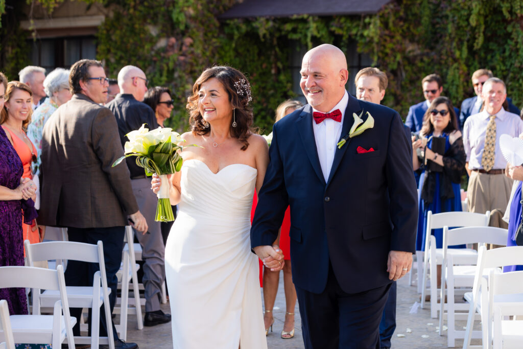 Dallas wedding photographer captures bride and groom walking out holding hands