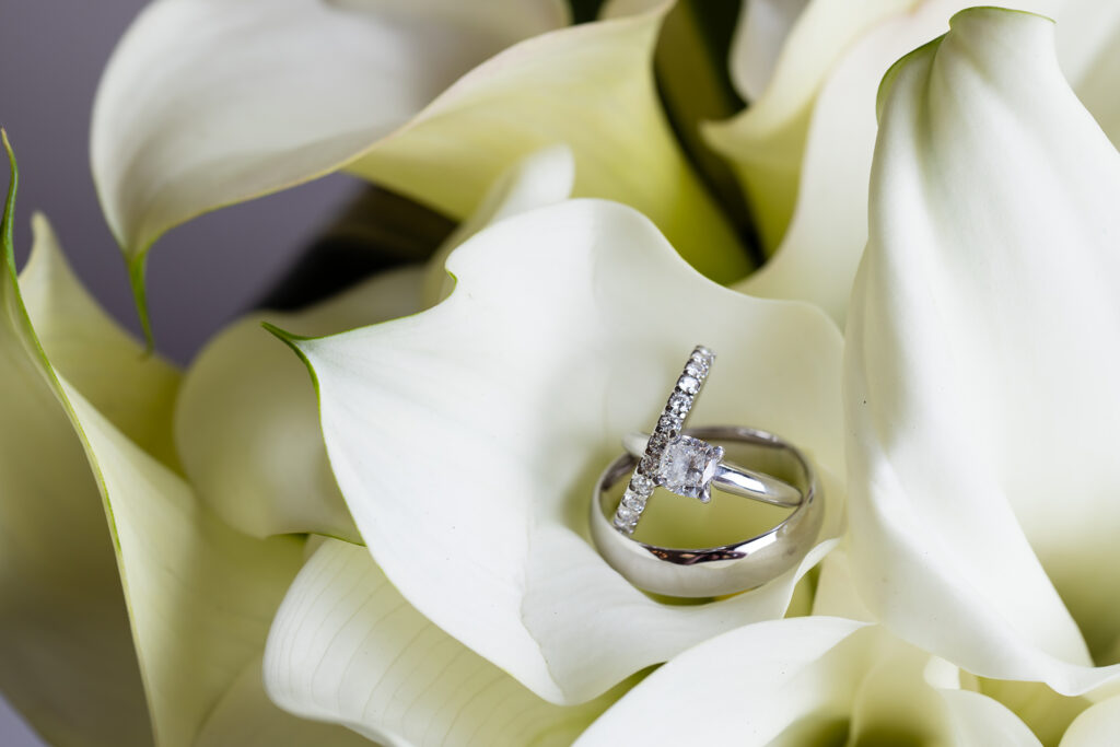 Wedding rings in white bridal bouquet
