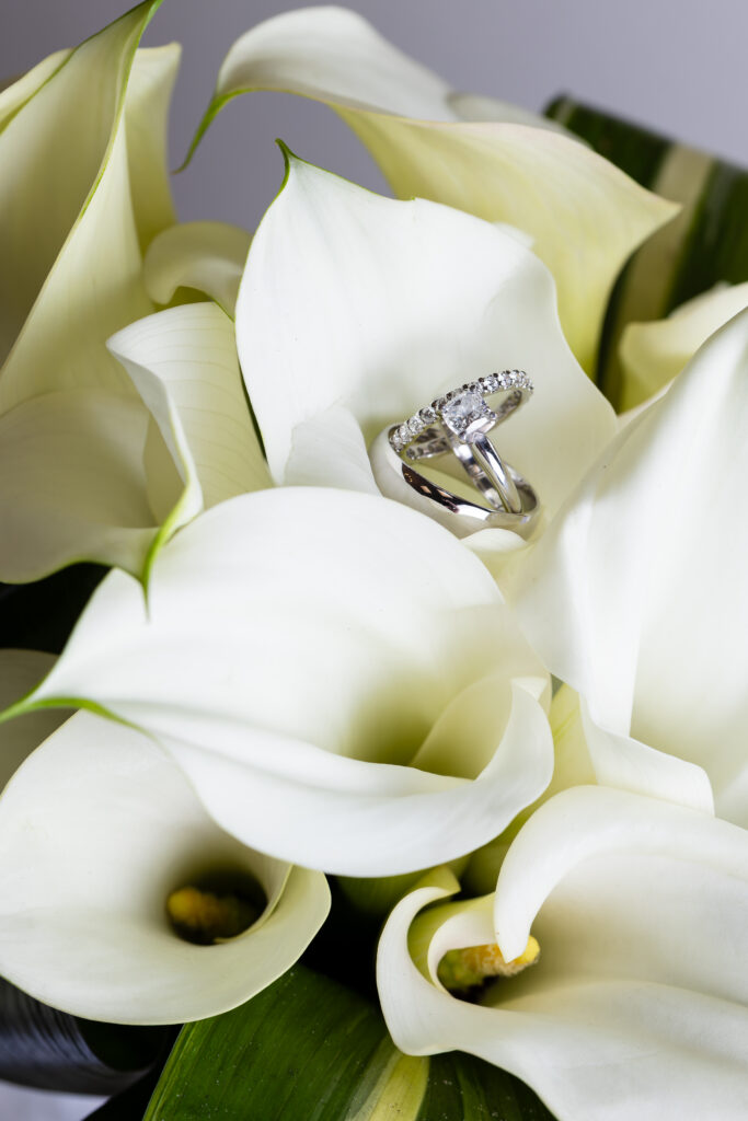 Dallas wedding photographer captures wedding rings in bridal bouquet