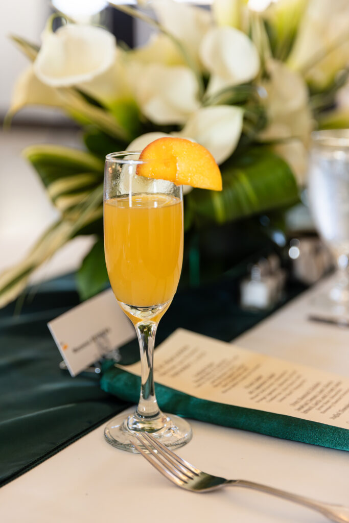 Dallas wedding photographer captures mimosa with orange slice on glass