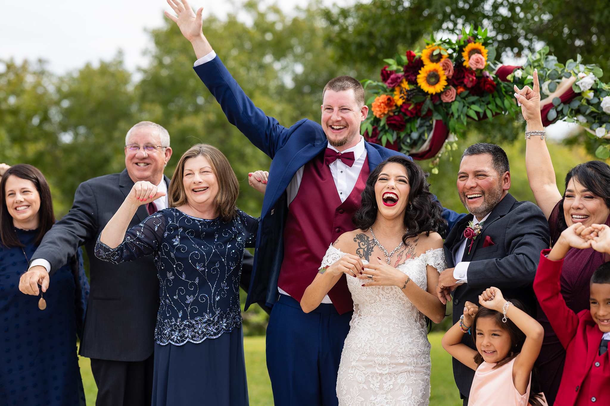 Bride, groom and family celebrating after wedding ceremony at wedding venue in Azle TX