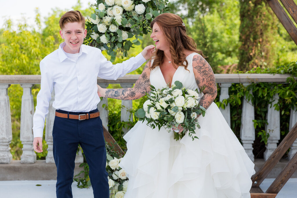 Red haired bride laughing with nephew