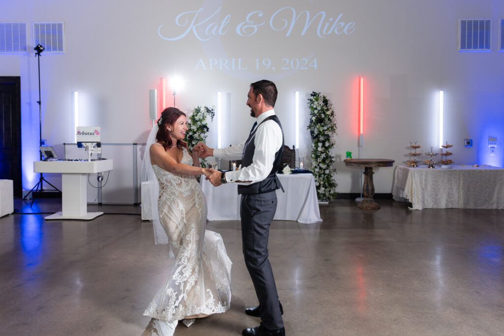 Bride and groom dancing on dance floor during wedding reception in Azle TX