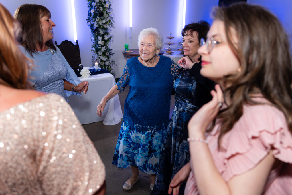 Grandma on dance floor with wedding guests