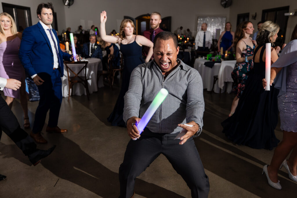 Man laughing on the dance floor during Azle wedding reception