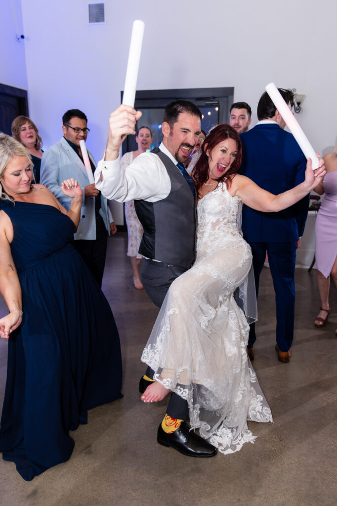 Bride and groom dancing with LED light sticks