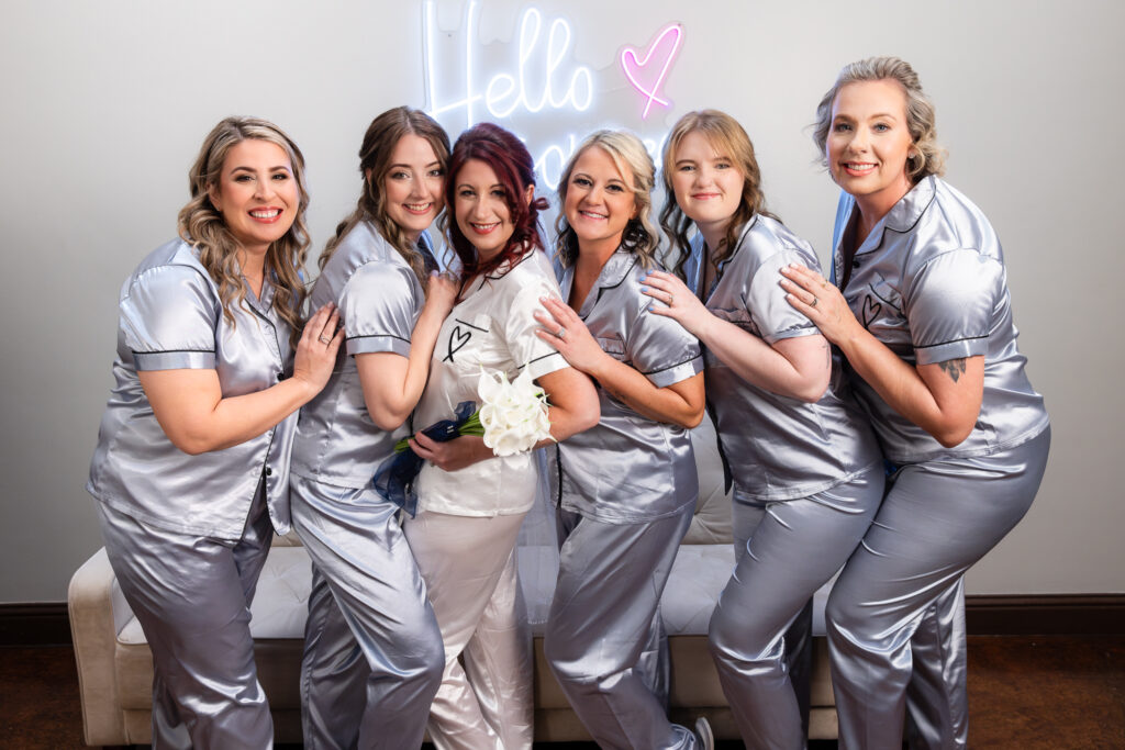 Bride and bridesmaids in wedding pjs in Azle wedding venue bridal suite