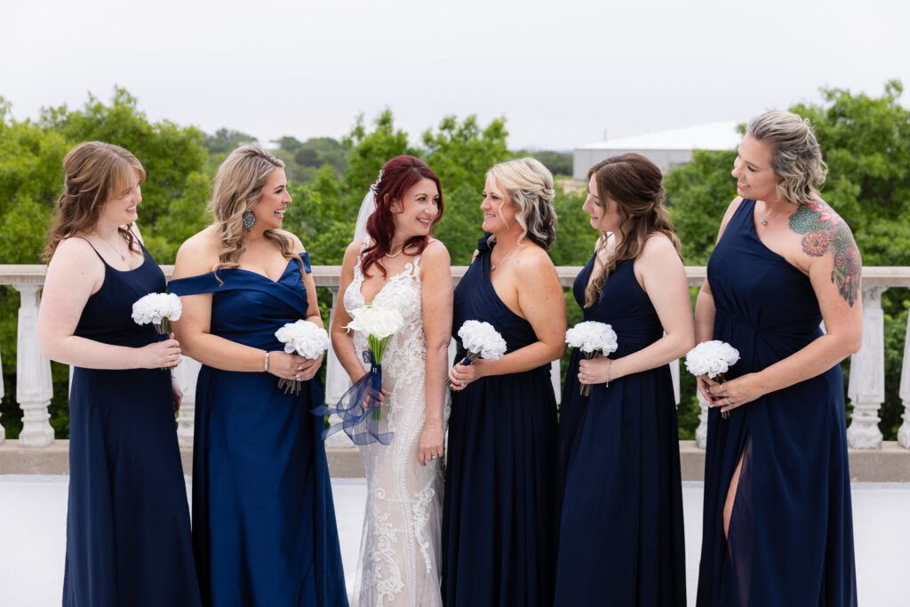 Bride smiling at bridesmaids