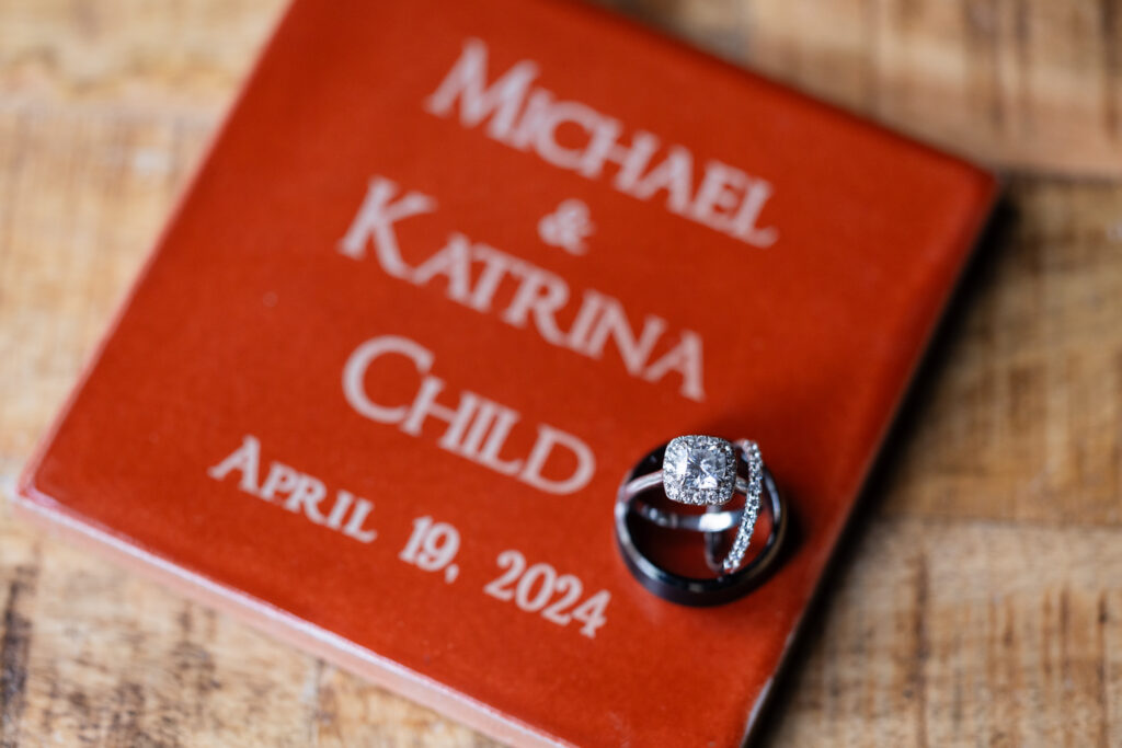 Wedding rings on custom orange tile