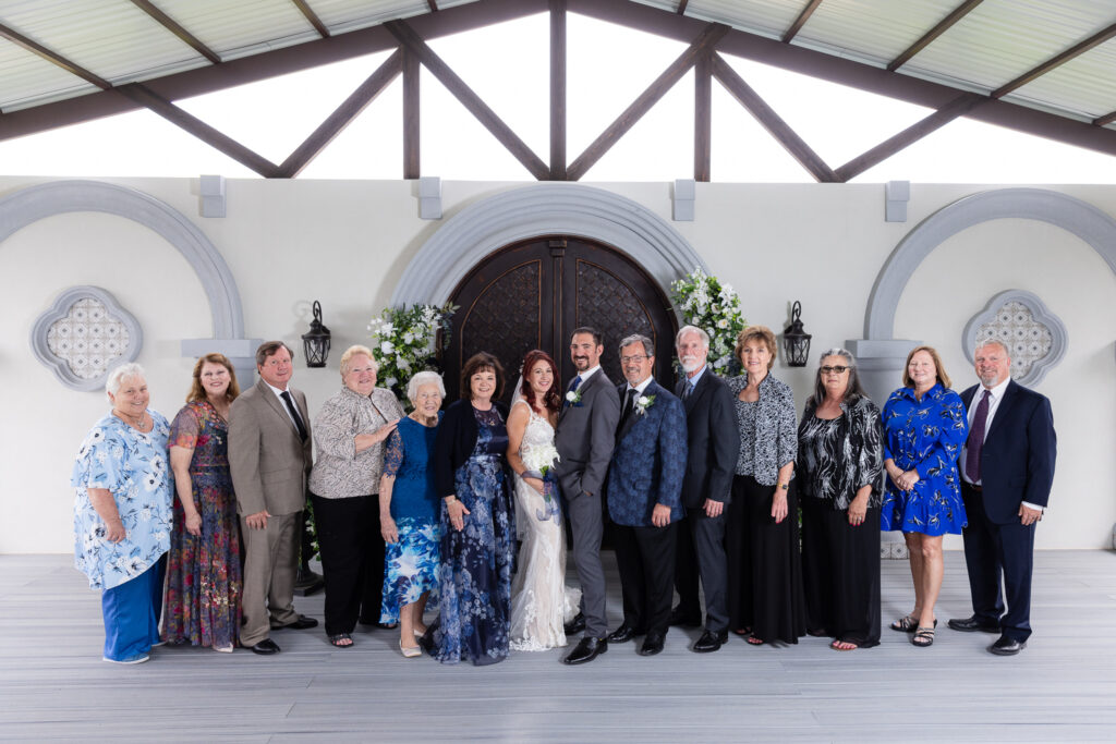 Large family photo with bride and groom at Azle TX ceremony space