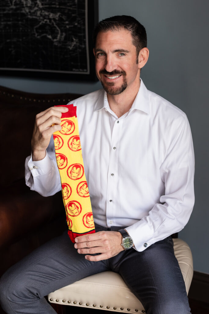 Groom happily showing off Iron Man yellow and red socks