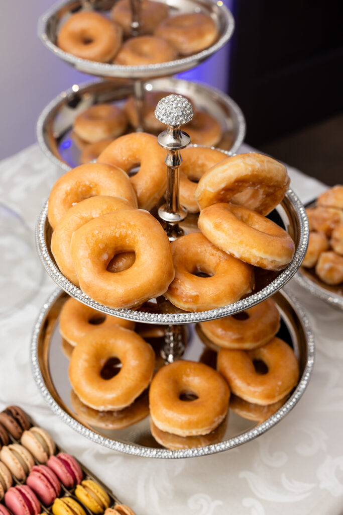 Donuts on dessert table at wedding reception