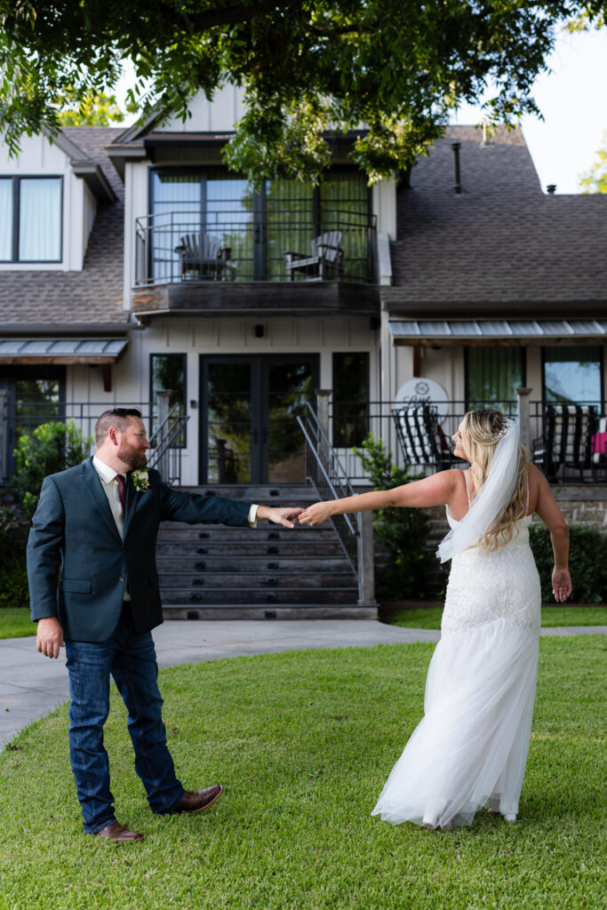 Wedding couple dancing on lawn at hotel in Granbury