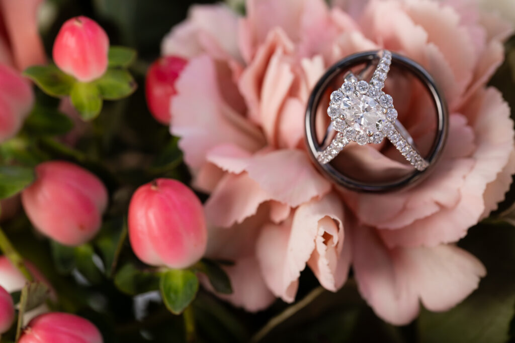 Elegant diamond engagement ring, diamond wedding band and unique multi material wedding band in pink flowers