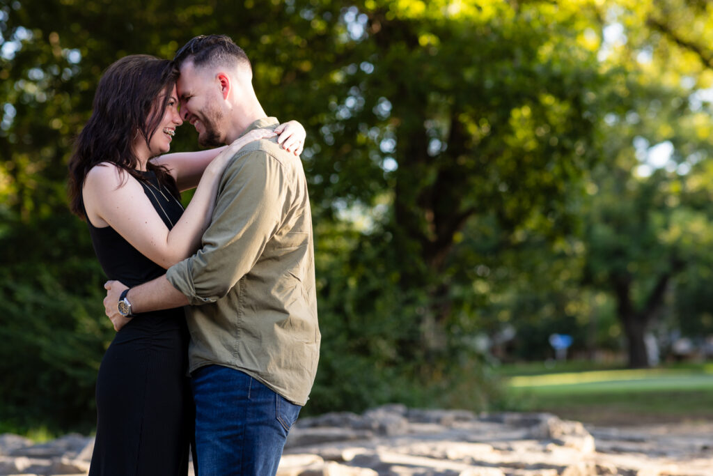 Engaged couple forehead to forehead during sweet Richardson Park engagement session