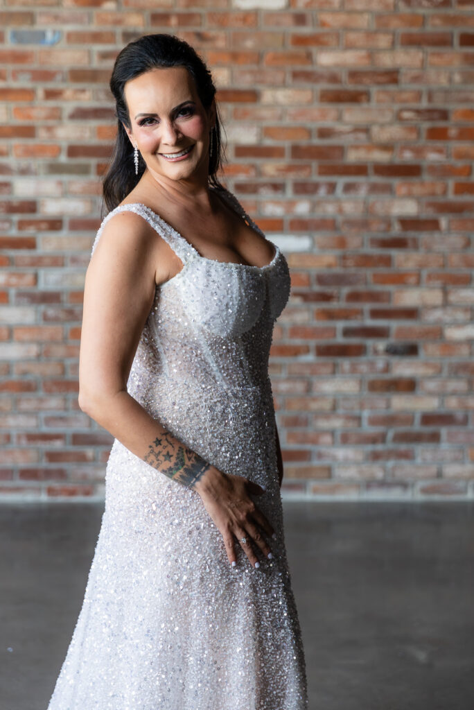 bride standing in front of brick wall in a Galia Lahav Oriana sparkling a-line wedding dress at Prosper Wine House